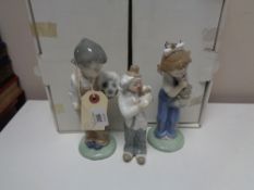 Two Nao figures of children together with a further Cascades figure, all parts boxed.