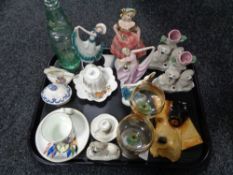 A tray of china ornaments, three Staffordshire figures, dog plaque, antique mineral water bottle,