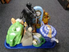 A tray of metal figure on plinth, Ringtons china teapot, ceramic table clock,