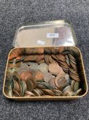 A vintage tin of coins,
