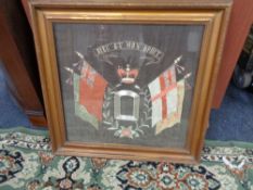 A nineteenth century embroidered military insignia in gilt frame