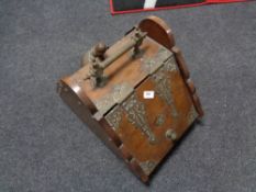 A nineteenth century brass mounted mahogany coal scuttle with shovel