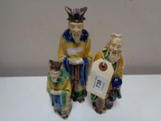 Three twentieth century glazed pottery figures of Chinese elders
