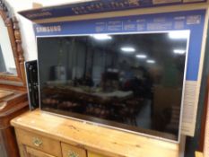 A Panasonic 50 inch lcd smart tv model TX L50E6B with remote control and table stand (in full