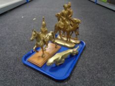 Two 19th century brass door stops together with a brass jaguar ornament,