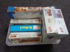 A crate containing model kits, mainly buildings,