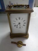 A twentieth century brass carriage clock with key CONDITION REPORT: Loss to enamel