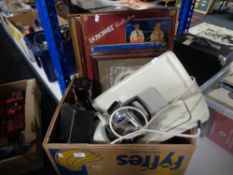 A box containing Teasmade, box camera, metal sign,