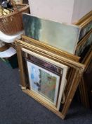 Two gilt picture frames, oil on canvas depicting boats,
