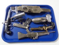 A quantity of novelty lighters, machine gun,