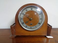 A 1920's oak mantel clock