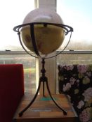 A large globe on metal stand