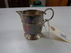 A silver cream jug, Birmingham William Suckling 1937, 56.3g.