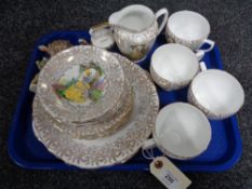 An English bone china tea set with 22ct gold gilding together with Wade Whimsies and animal figures.