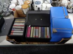 A box of cds, cases containing cds.