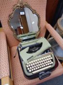 A small ornate gilt framed mirror together with an Impex Maria typewriter
