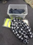 A crate of new and un-used clothing, thermal outdoor trousers,