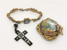 An antique enamel brooch,