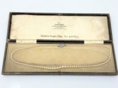 A single strand cultured pearl necklace with 9ct white gold clasp,