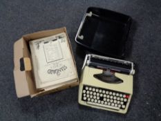 A cased Brother Deluxe typewriter and a box of sheet music
