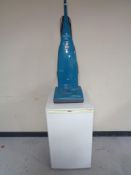 A Zanussi under bench freezer and an Electrolux contour vacuum cleaner