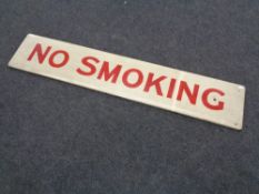 A hand painted wooden sign 'No Smoking'