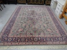 A machined carpet of Tabriz design, on green ground,