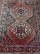 An Afghan rug of geometric design,