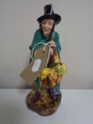 A Royal Doulton figure, The Mask Seller,