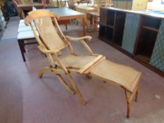 A teak and bergere steamer garden armchair