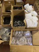 A pallet of plastic oil cans, caps and covers,