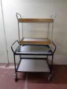 Two 20th century tubular metal two tier trolleys