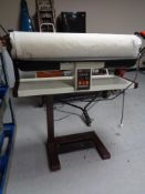 A Pfaff 854 rotary iron on stand