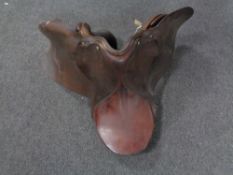A brown leather saddle