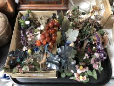 A tray of glass grapes and foliage