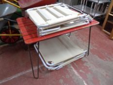 A painted 20th century wooden topped garden table on hairpin legs,