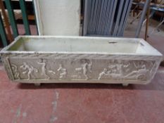 A painted concrete plant trough of classical design,