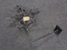 A cast iron wall weather vane modelled as a Blacksmith