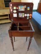 A 19th century mahogany work table on reeded legs