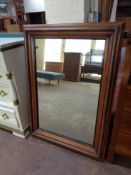 A 19th century walnut wall mirror,