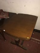 A 1930's oak extending dining table,
