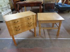 A blond oak serpentine fronted three drawer chest together with a blond oak square coffee table