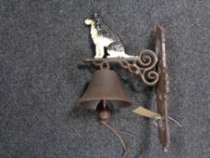 A cast iron bell modelled as collie dog