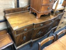 A late Victorian mahogany four door break-front sideboard