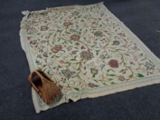 A wicker hand basket of a large hand stitched throw