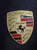 A large aluminium Porsche plaque