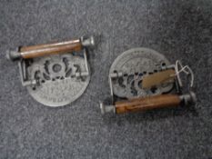 Two cast iron toilet roll holders 