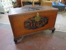 A carved oriental camphor wood blanket box