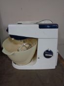 A Kenwood Chef food mixer with original cover