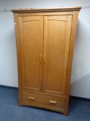 A three piece Mamas & Papas oak nursery suite - wardrobe,